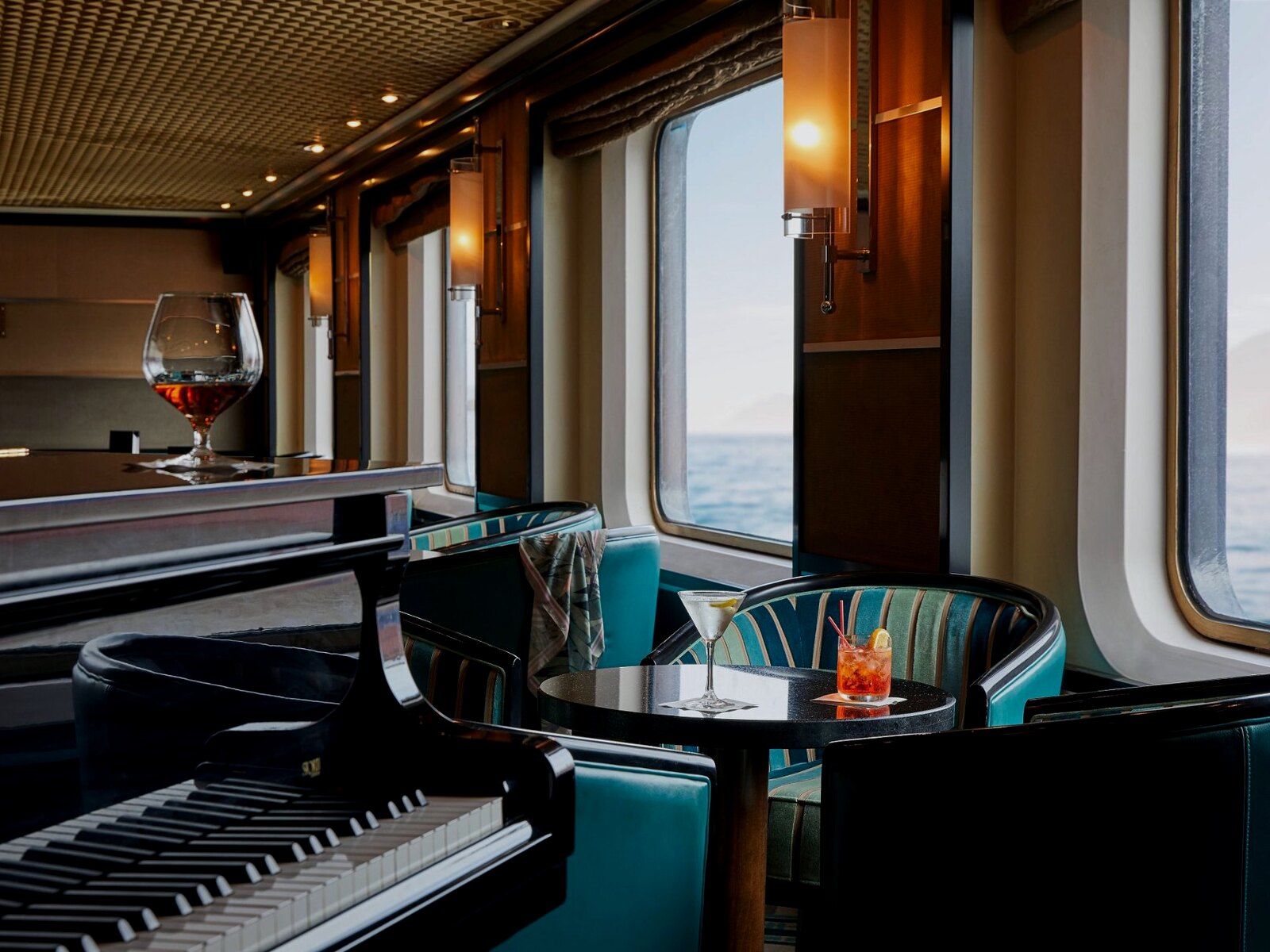 Onboard piano lounge with cocktail service at sea